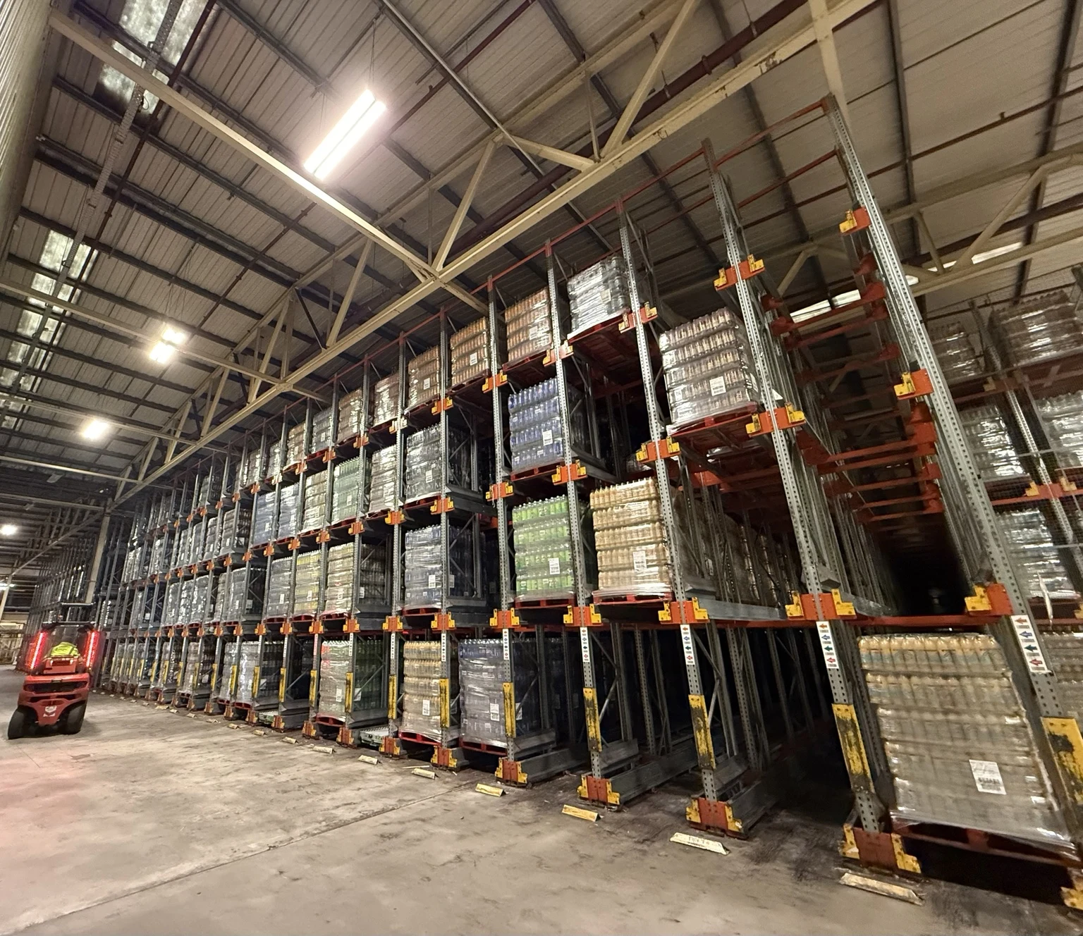 Shuttle rack system storing pallets, with location labels on the uprights